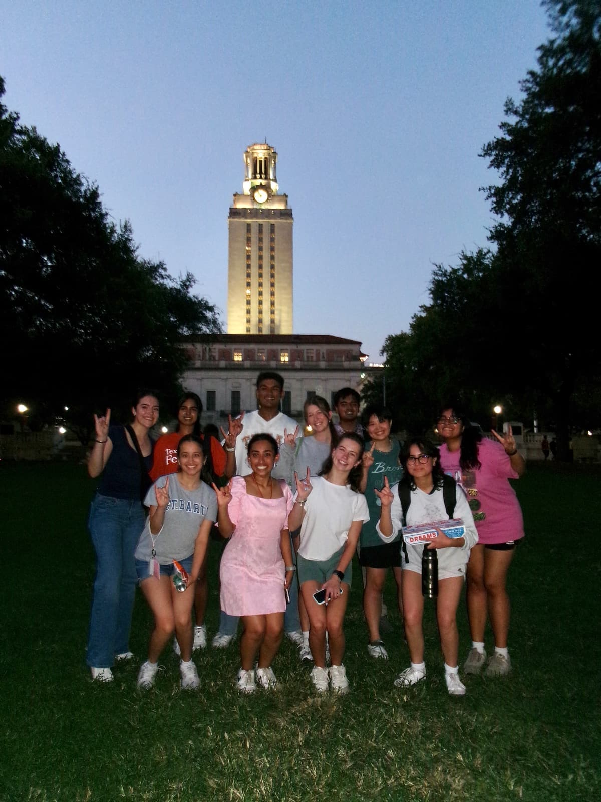 MISA members outside the UT Tower at dusk