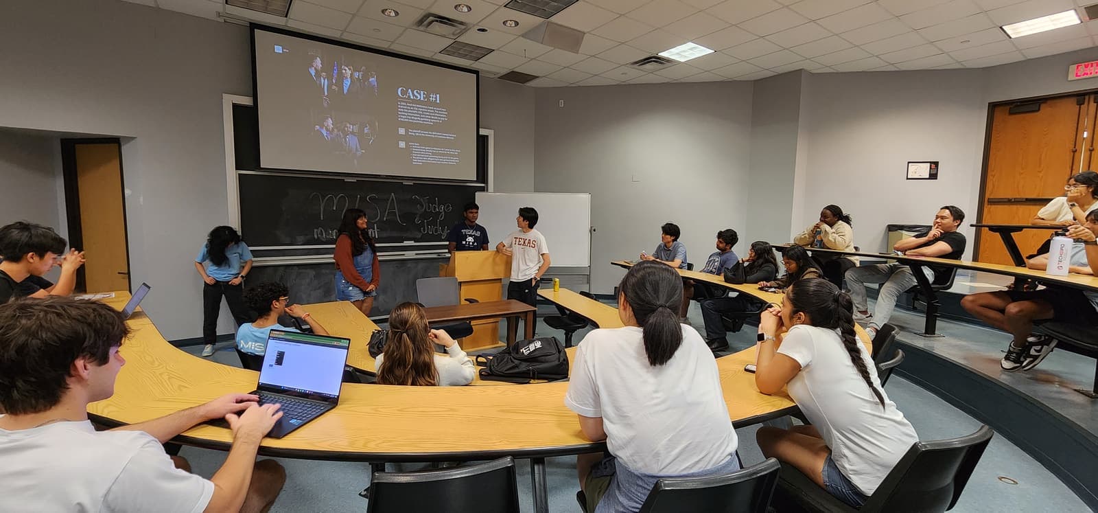 MISA members working on laptops during a technical workshop